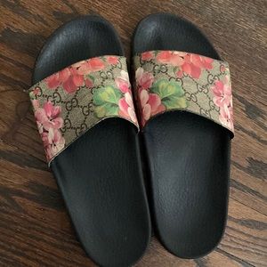 Old worn Gucci slides